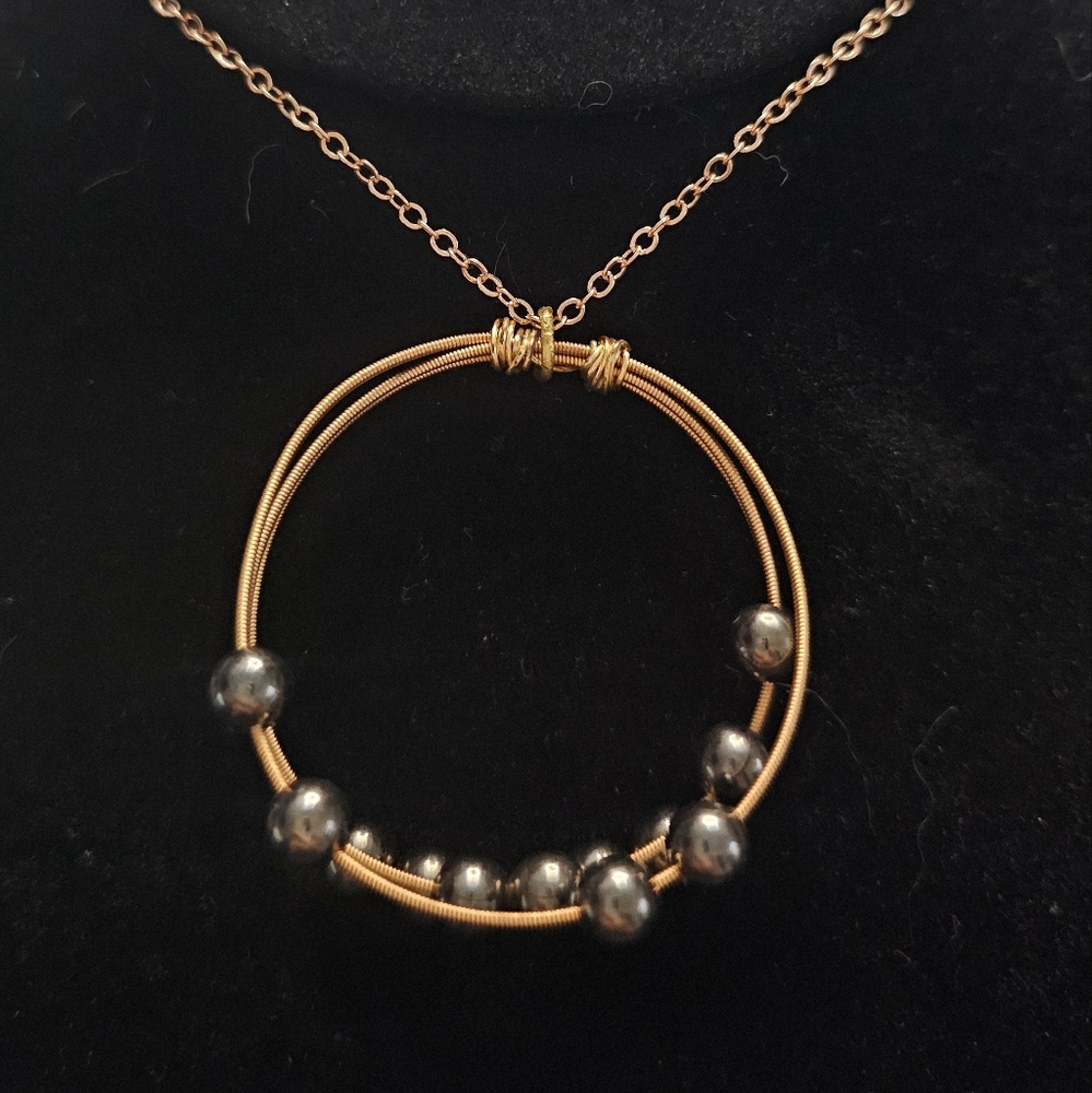 Handcraftrd Guitar String Fidget Necklace Goldtone With Gun Metal Floating Beads